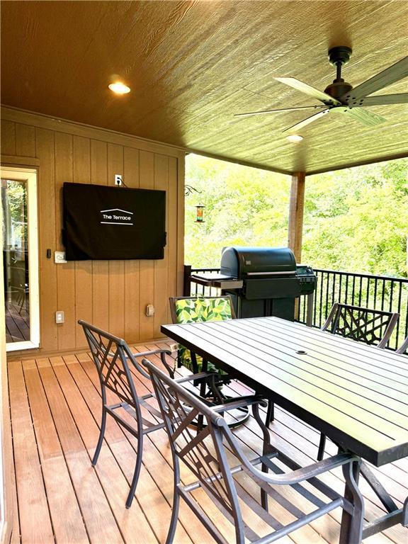 4531 Anderson St, Shawnee, KS 66226 - wooden terrace featuring ceiling fan, outdoor dining area, and area for grilling