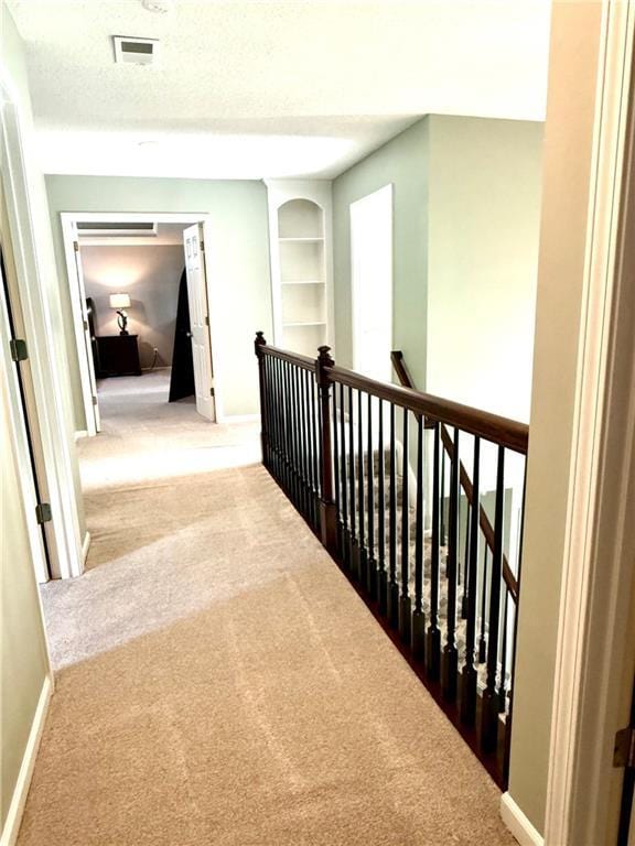 4531 Anderson St, Shawnee, KS 66226 - hall with carpet flooring, an upstairs landing, and built in features