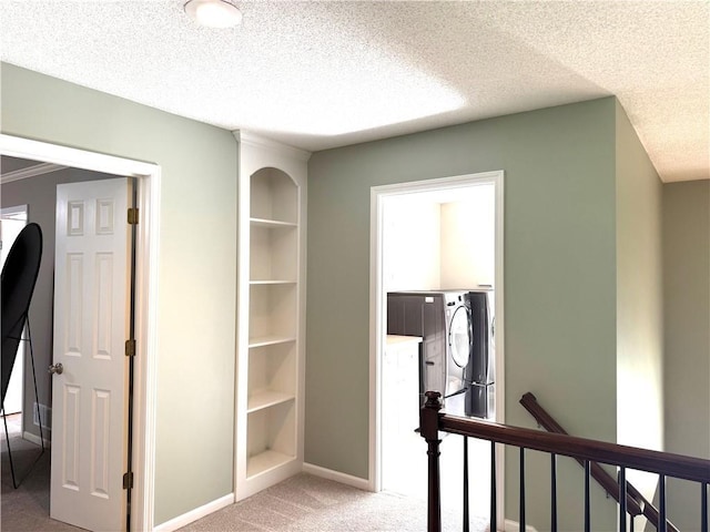 4531 Anderson St, Shawnee, KS 66226 - corridor featuring an upstairs landing, carpet, washer / dryer, and a textured ceiling
