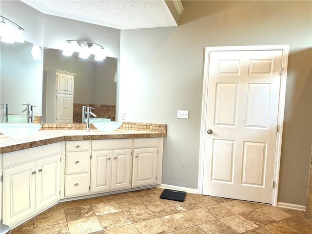 4531 Anderson St, Shawnee, KS 66226 - bathroom with double vanity and a textured ceiling