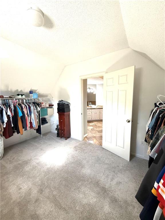 4531 Anderson St, Shawnee, KS 66226 - walk in closet with lofted ceiling and carpet floors