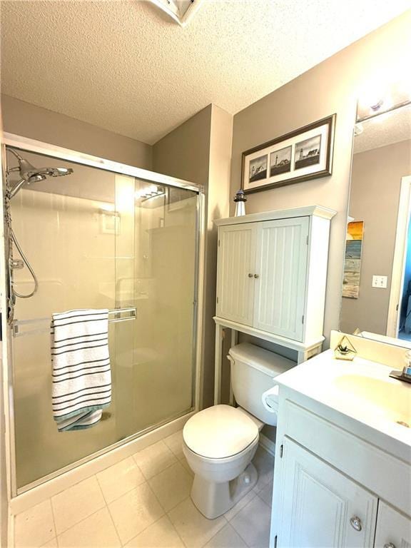 4531 Anderson St, Shawnee, KS 66226 - bathroom featuring a textured ceiling, a shower stall, vanity, and tile patterned floors