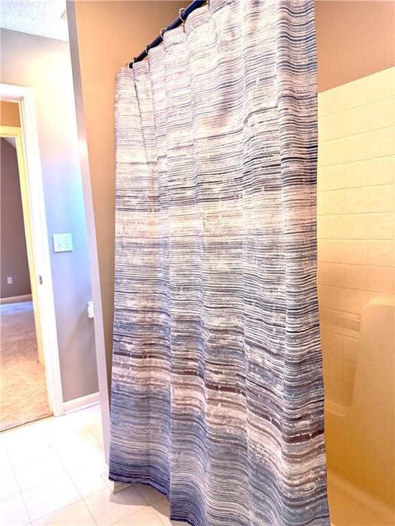 4531 Anderson St, Shawnee, KS 66226 - full bathroom featuring curtained shower and tile patterned floors