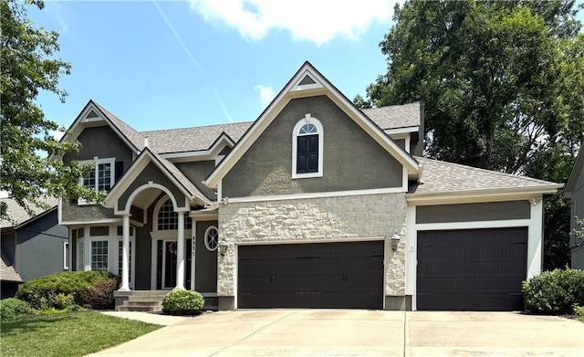 4531 Anderson St, Shawnee, KS 66226 - craftsman house with driveway, stucco siding, stone siding, and an attached garage