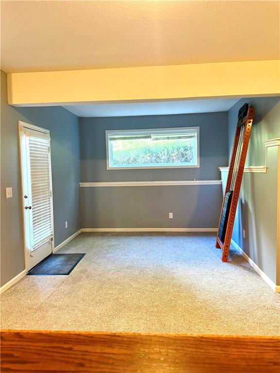 4531 Anderson St, Shawnee, KS 66226 - carpeted empty room with healthy amount of natural light