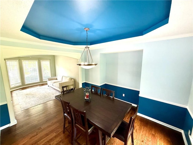 4531 Anderson St, Shawnee, KS 66226 - dining area featuring a raised ceiling, wood-type flooring, and ornamental molding