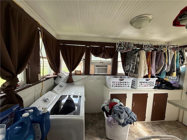 704 W 2nd St, Coffeyville, KS 67337 - washroom featuring washing machine and clothes dryer, stone finish floors, and cooling unit
