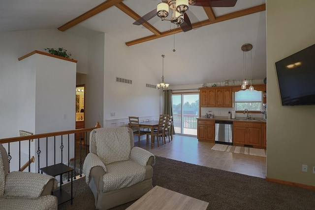 127 Hondo St, Lathrop, MO 64465 - living room featuring a ceiling fan, light carpet, beamed ceiling, high vaulted ceiling, and a chandelier