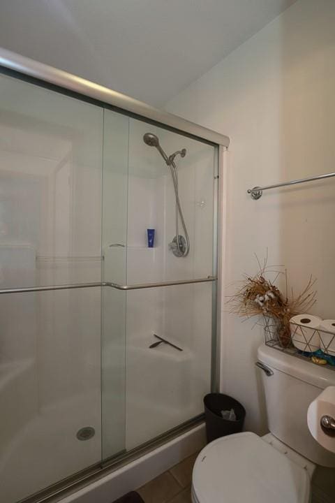 127 Hondo St, Lathrop, MO 64465 - bathroom with a stall shower and tile patterned floors