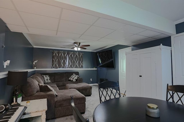 127 Hondo St, Lathrop, MO 64465 - living room with carpet floors, a ceiling fan, ornamental molding, and a paneled ceiling