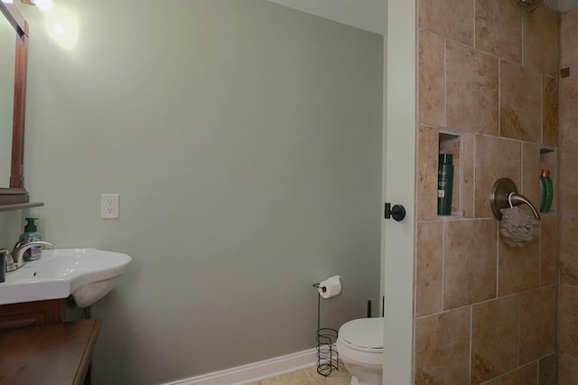 127 Hondo St, Lathrop, MO 64465 - bathroom featuring vanity, tile patterned floors, and tiled shower