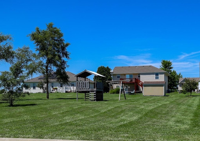 127 Hondo St, Lathrop, MO 64465 - view of green lawn with a wooden deck