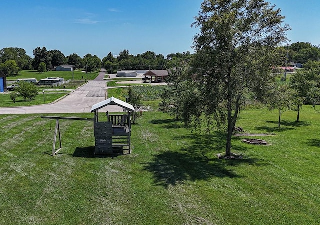 127 Hondo St, Lathrop, MO 64465 - view of property's community featuring a lawn and view of scattered trees