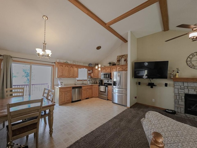 127 Hondo St, Lathrop, MO 64465 - kitchen with stainless steel appliances, beamed ceiling, a ceiling fan, light countertops, and a chandelier