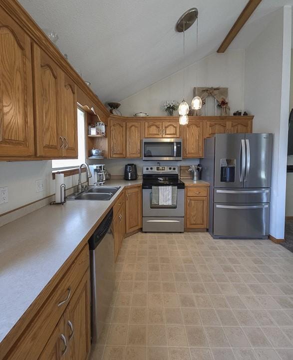 127 Hondo St, Lathrop, MO 64465 - kitchen with stainless steel appliances, brown cabinetry, light countertops, decorative light fixtures, and open shelves