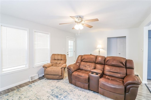 516 W 7th St, Carrollton, MO 64633 - living area with wood finished floors and ceiling fan