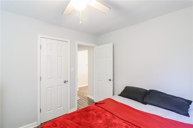 516 W 7th St, Carrollton, MO 64633 - bedroom with wood finished floors and a ceiling fan