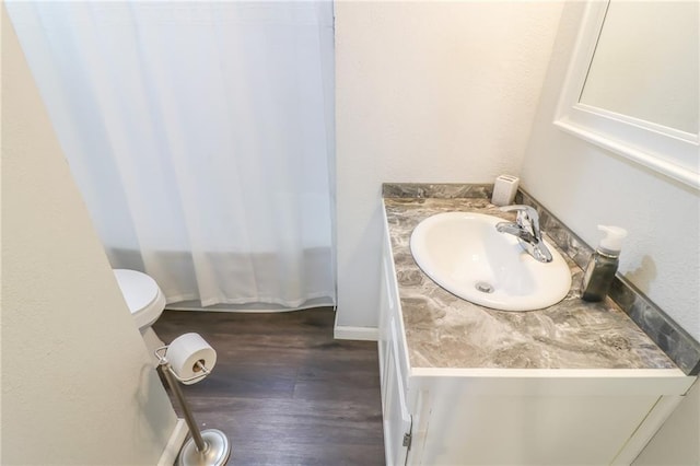 516 W 7th St, Carrollton, MO 64633 - bathroom featuring vanity, wood finished floors, and shower / bath combination with curtain