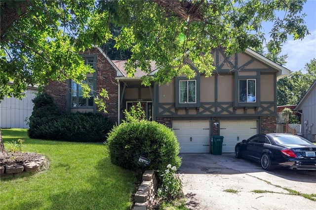 11579 Earnshaw St, Overland Park, KS 66210 - tudor house featuring brick siding, a front lawn, a garage, driveway, and stucco siding