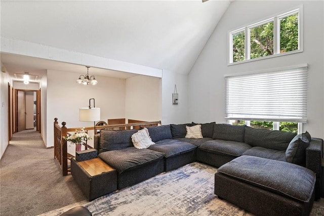 11579 Earnshaw St, Overland Park, KS 66210 - carpeted living area featuring high vaulted ceiling and a chandelier