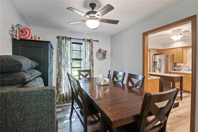 11579 Earnshaw St, Overland Park, KS 66210 - dining area featuring a ceiling fan and light wood-style floors