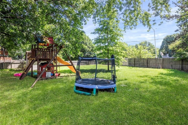 11579 Earnshaw St, Overland Park, KS 66210 - fenced backyard featuring a trampoline and a playground