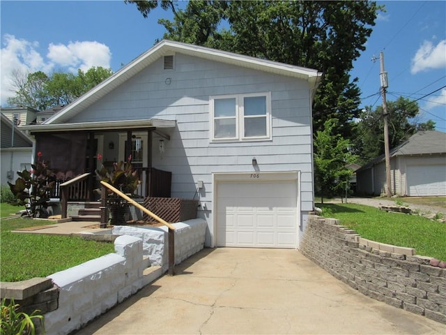 706 W 10th St, Sedalia, MO 65301 - view of front of house featuring an attached garage, driveway, and a front yard