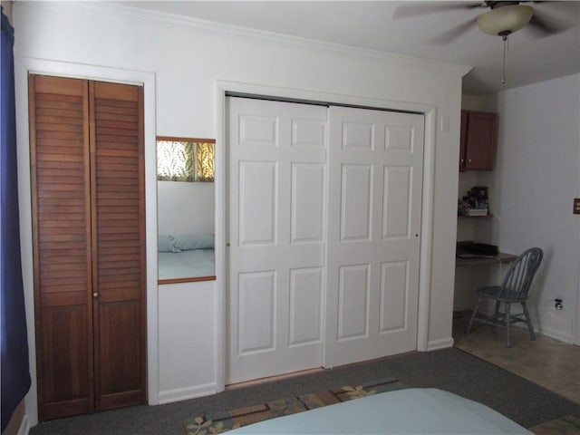 706 W 10th St, Sedalia, MO 65301 - bedroom featuring crown molding, two closets, a ceiling fan, and carpet