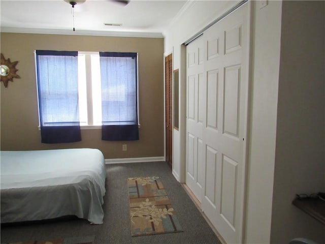 706 W 10th St, Sedalia, MO 65301 - bedroom featuring dark colored carpet, a closet, ornamental molding, and ceiling fan