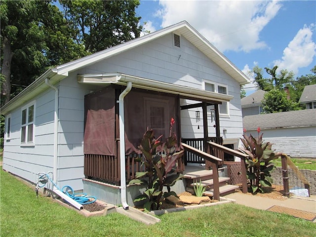 706 W 10th St, Sedalia, MO 65301 - view of front of house with a sunroom