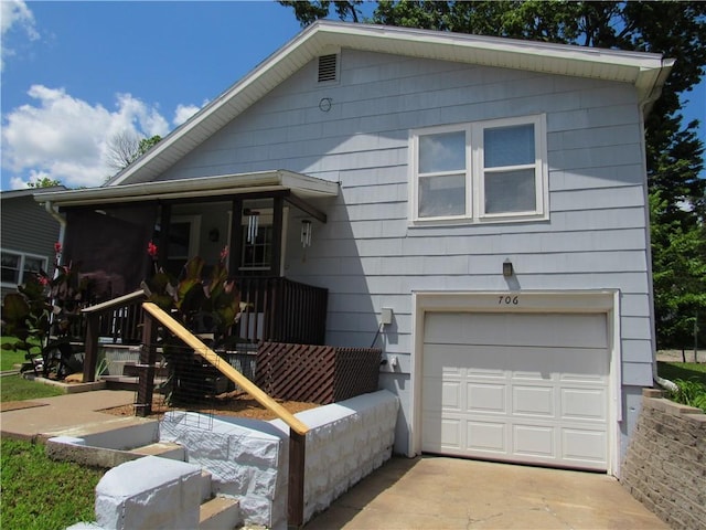 706 W 10th St, Sedalia, MO 65301 - view of front of property with an attached garage and concrete driveway