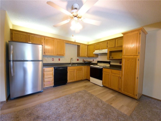 2604 S Peck Ct Unit B, Independence, MO 64055 - kitchen with white electric range oven, freestanding refrigerator, dishwasher, under cabinet range hood, and dark countertops