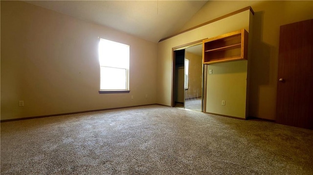 2604 S Peck Ct Unit B, Independence, MO 64055 - unfurnished bedroom featuring carpet flooring and lofted ceiling