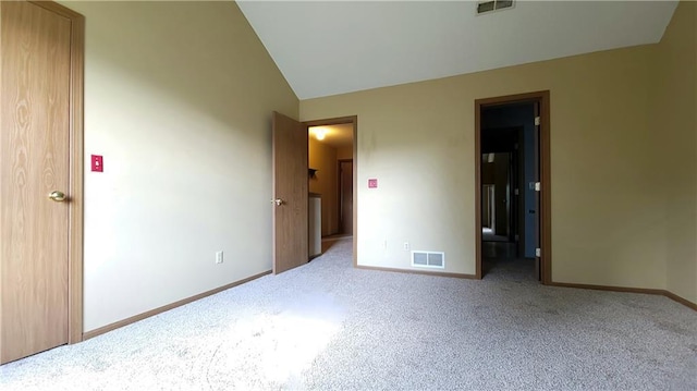 2604 S Peck Ct Unit B, Independence, MO 64055 - unfurnished bedroom with carpet flooring and lofted ceiling