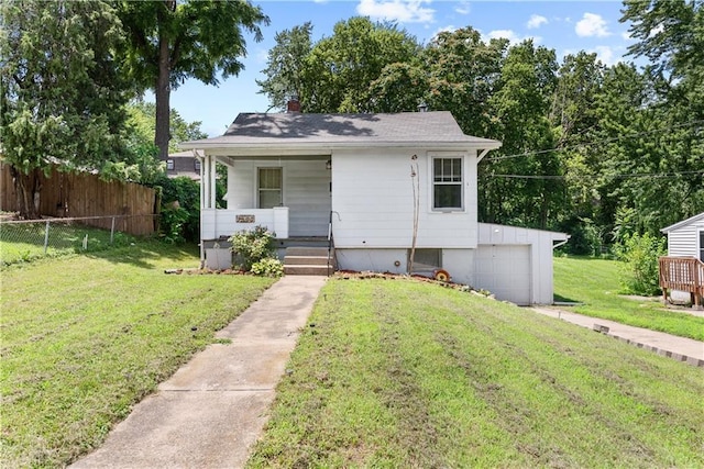1234 S Pearl St, Independence, MO 64055 - bungalow-style home featuring a porch and driveway