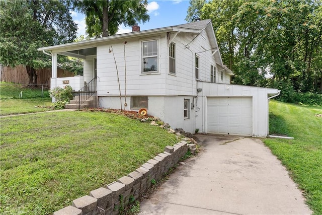 1234 S Pearl St, Independence, MO 64055 - view of front facade featuring driveway, a chimney, and an attached garage