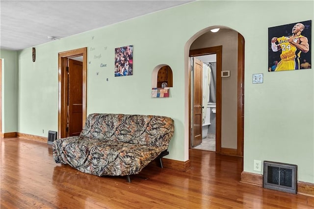 1234 S Pearl St, Independence, MO 64055 - living area with wood finished floors and arched walkways