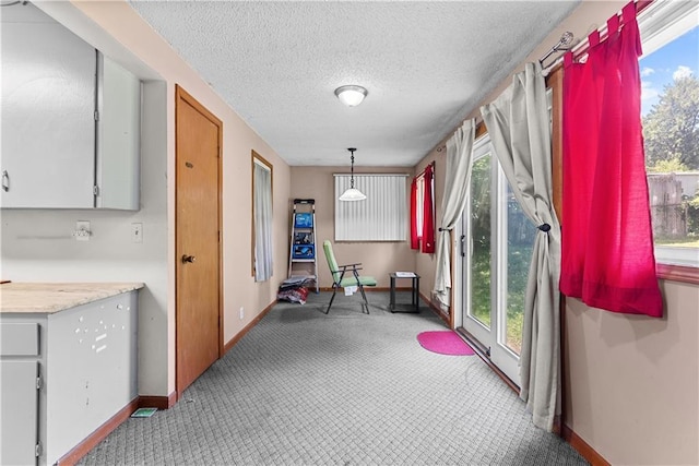 1234 S Pearl St, Independence, MO 64055 - dining room featuring carpet flooring and a textured ceiling