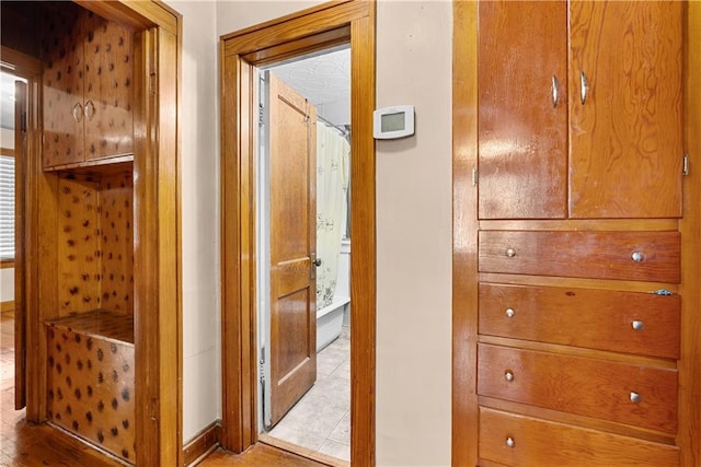 1234 S Pearl St, Independence, MO 64055 - hallway featuring wood finished floors and baseboards
