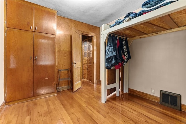 1234 S Pearl St, Independence, MO 64055 - unfurnished bedroom with light wood-style flooring and baseboards