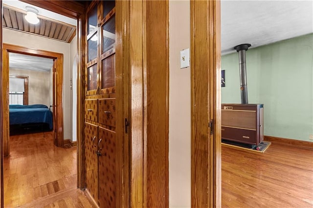 1234 S Pearl St, Independence, MO 64055 - hallway featuring wood finished floors and baseboards