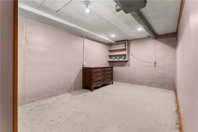 1234 S Pearl St, Independence, MO 64055 - finished below grade area featuring tile patterned floors and a paneled ceiling