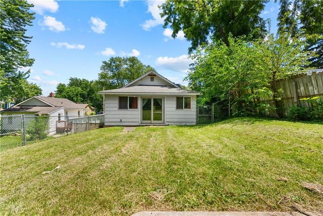 1234 S Pearl St, Independence, MO 64055 - back of house featuring a fenced backyard