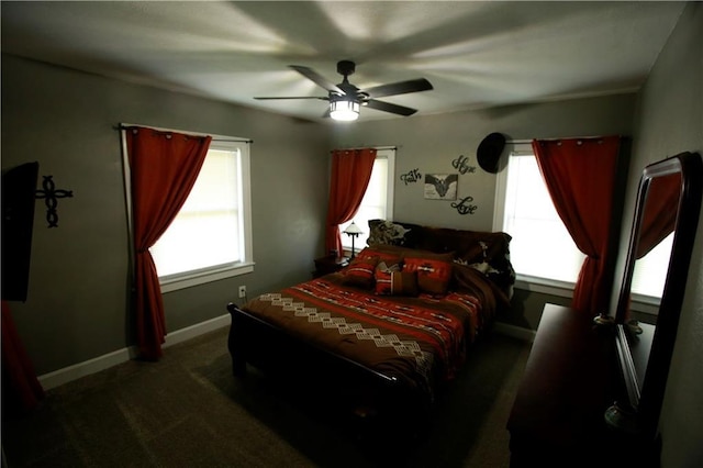 383 E Broadway St, Peculiar, MO 64078 - bedroom featuring dark carpet, multiple windows, and a ceiling fan