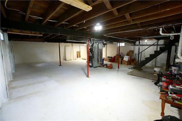 383 E Broadway St, Peculiar, MO 64078 - unfinished below grade area with stairway and heating unit