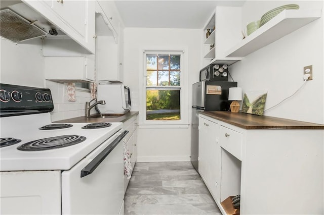6347 Sni A Bar Rd, Kansas City, MO 64129 - kitchen featuring white electric range oven, white cabinets, under cabinet range hood, backsplash, and open shelves