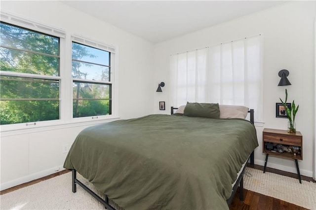 6347 Sni A Bar Rd, Kansas City, MO 64129 - bedroom with wood finished floors and baseboards
