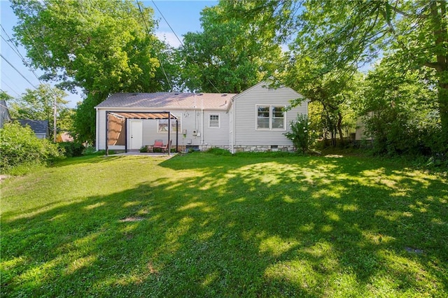 6347 Sni A Bar Rd, Kansas City, MO 64129 - rear view of house featuring a lawn