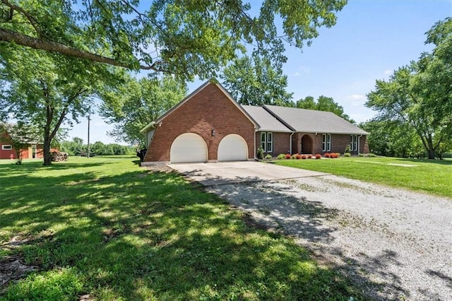 1803 N Jeter Rd, Raymore, MO 64083 - single story home featuring gravel driveway, an attached garage, brick siding, and a front lawn