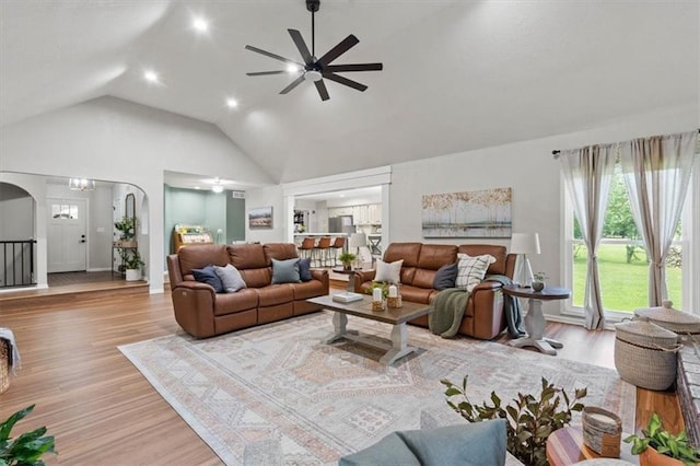 1803 N Jeter Rd, Raymore, MO 64083 - living area with a ceiling fan, wood finished floors, arched walkways, recessed lighting, and high vaulted ceiling